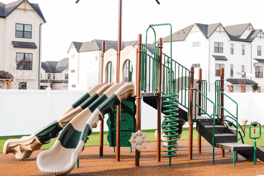 playground next to apartment building.